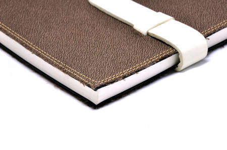 A slightly scuffed book cover with a linen textured binding の写真素材