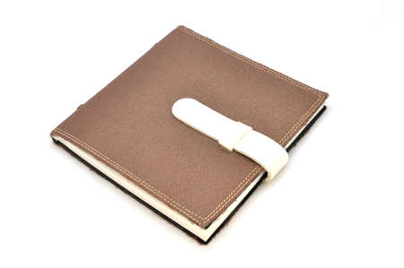 A slightly scuffed book cover with a linen textured binding の写真素材