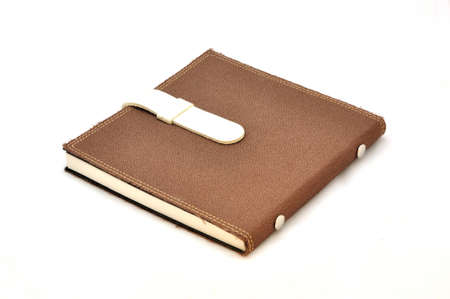 A slightly scuffed book cover with a linen textured binding の写真素材