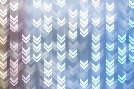 abstract direction arrows on blurred background.の写真素材