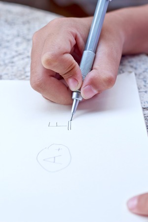 Child drawing in note book.の写真素材