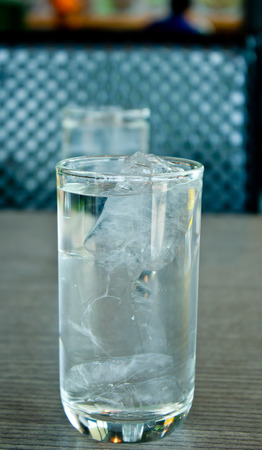 Glass of drink water in table setting to lunch.の写真素材