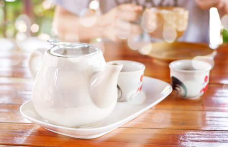 Creative double exposure tea pot combined with blured bokeh backgroundの写真素材