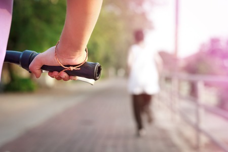 Cycling In Countryside.Focused on handle of bike and hand.の写真素材