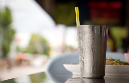 Drink water in metal cupの写真素材