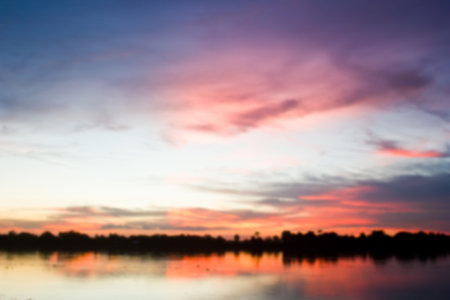 Gold light on sun set with light on the river.Idyllic Wallpaper Setting Sun.の写真素材