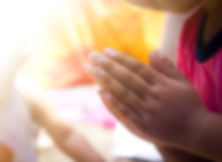 Blurred of Children praying hand.の写真素材