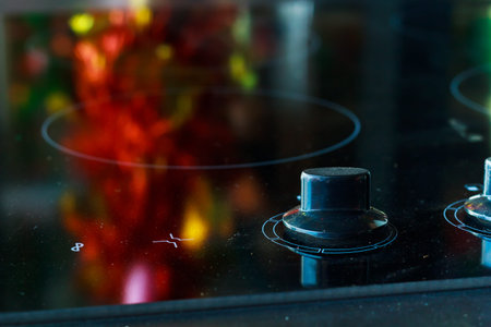 Close up of electric stove knobs.の写真素材