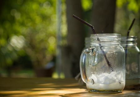 A glass of green tea with milk after drink,Empty glass of drink.の写真素材