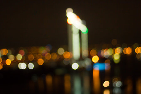 Defocused city night filtered bokeh abstract background.の写真素材