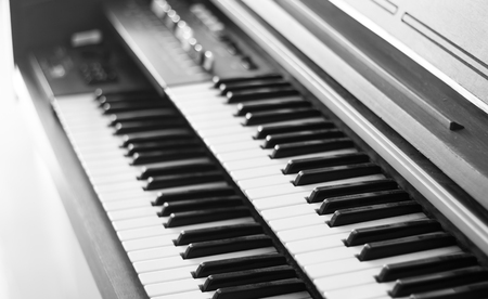 Piano keyboard background with selective focus.の写真素材
