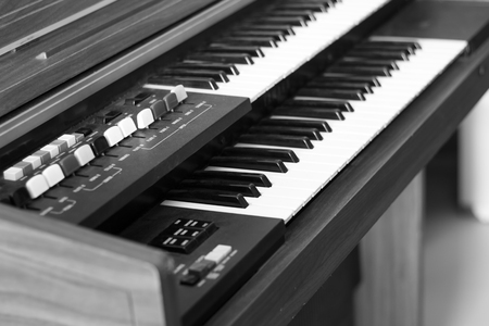 Piano keyboard background with selective focus.の写真素材