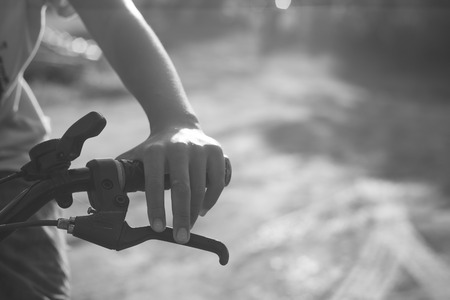 A boy  is cycling on play ground.Motion activity in sunset background.の写真素材