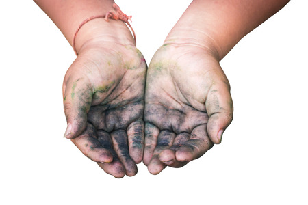 A boy Raising dirty hands beg for some food on white background with work paths.の写真素材