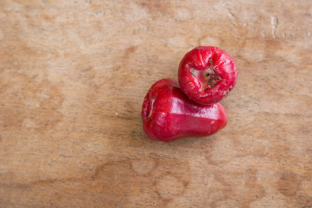 The rose apples on wood plank.の写真素材