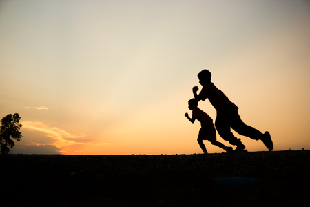 Fitness silhouette sunrise jogging workout wellness concept.の写真素材