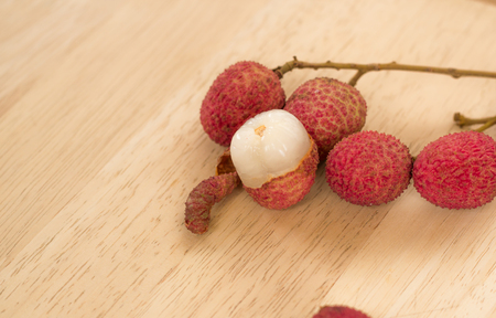 Fresh lychee on a wooden background.の写真素材