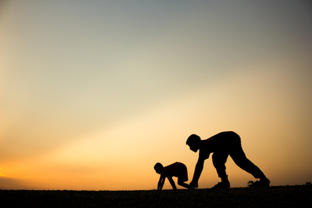 Fitness on silhouette sunrise The boy running workout wellness concept.の写真素材
