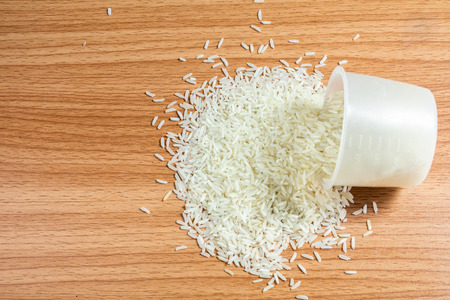 Rice on wooden floorの写真素材