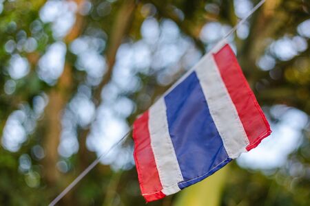 Thai flag on bokeh backgroundの写真素材