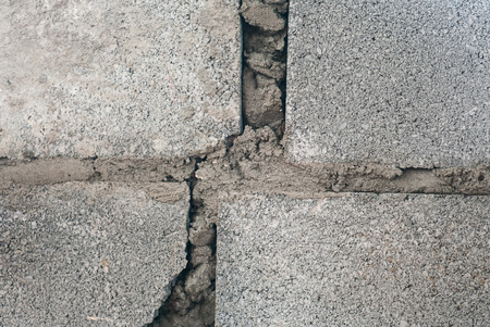 Closeup detail of a grey block wallの写真素材