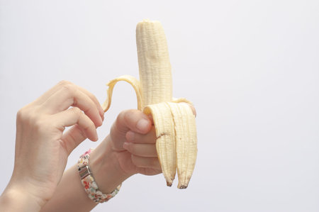 Peeling bananaの写真素材