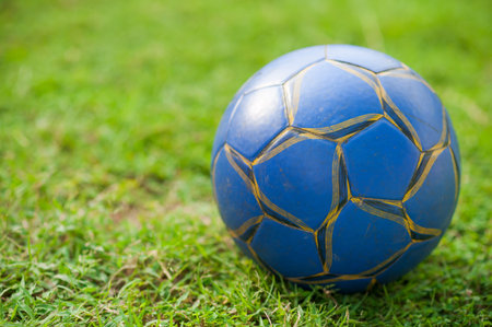 soccer ball on green grassの写真素材