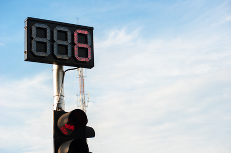LED traffic light number six show with cloud sky is background.の写真素材