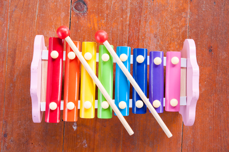 Wooden toy xylophone in rainbow colors. Educational toy for kids and toddlersの写真素材