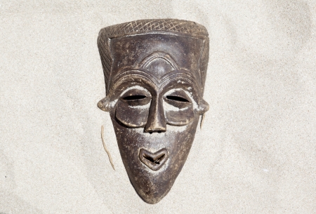 African mask on sand の写真素材