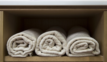 Towels in wooden storage close upの写真素材