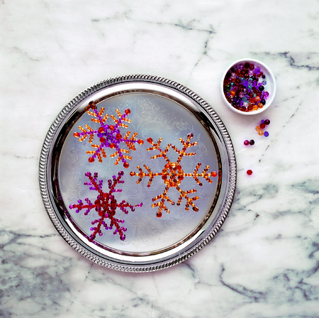 Snowflakes ornament made by glass beadsの写真素材