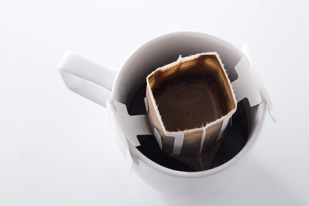 Instant freshly brewed cup of coffee,Drip bag fresh coffeeの写真素材