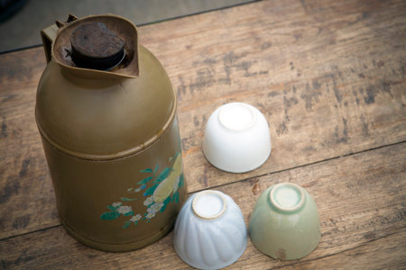 vacuum pot of tea and cups on wooden table,Myanmarの写真素材