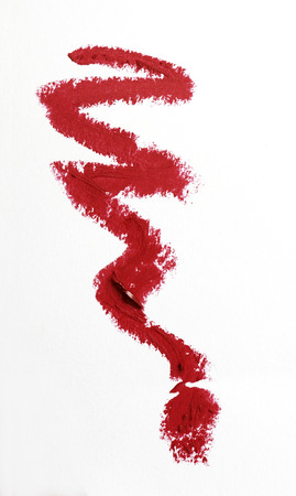 Red color lipstick stroke on white paperの写真素材