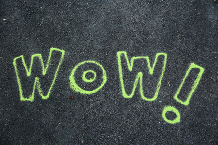 Wow word sand painting on groundの写真素材