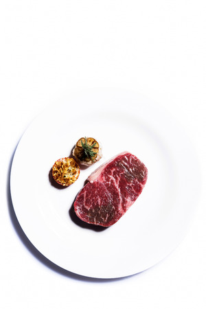 Fresh raw marble beef steak on plateの写真素材