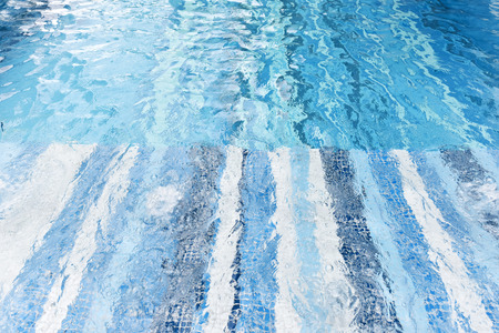 Background of rippled water in swimming poolの写真素材