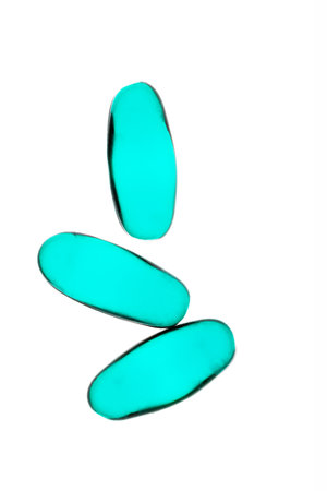 Bad shape expired blue pills on background