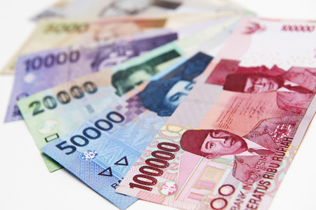 Colorful of Indonesia banknotes stacked on backgroundの写真素材