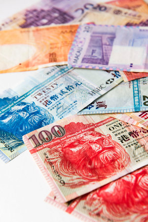 Stacked of Hong Kong and Macau Dollar bills,close up