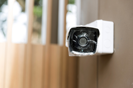 New Surveillance Camera cover by plastic wrap on wallの写真素材