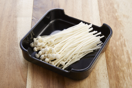 Enoki mushroom in tray for shabushabuの写真素材
