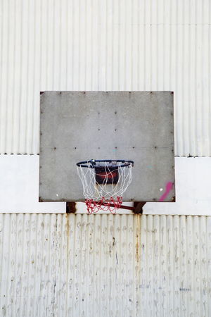 Basketball hoop on wallの写真素材
