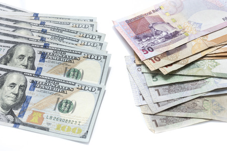 American dollars and Qatar riyals bank notes,American dollars against Qatar riyalsの写真素材