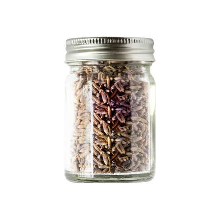 Organic dried lavender in bottle isolated on whiteの写真素材