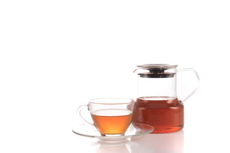 Cup of tea and teapot isolated on whiteの写真素材