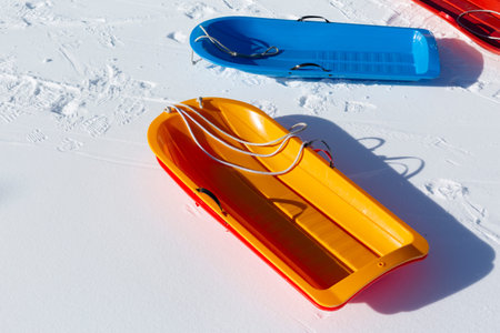 Empty colorful snow sledge on lockdown