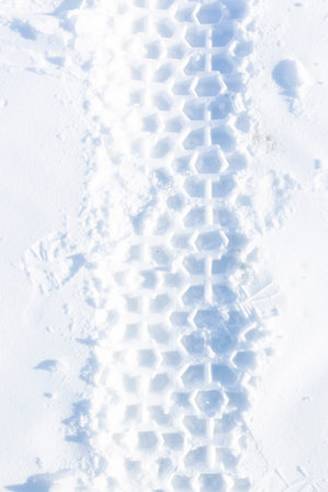 Snowmobile trace on snow background