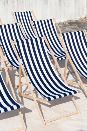 Close up group of Empty Blue stripe Beach chairs